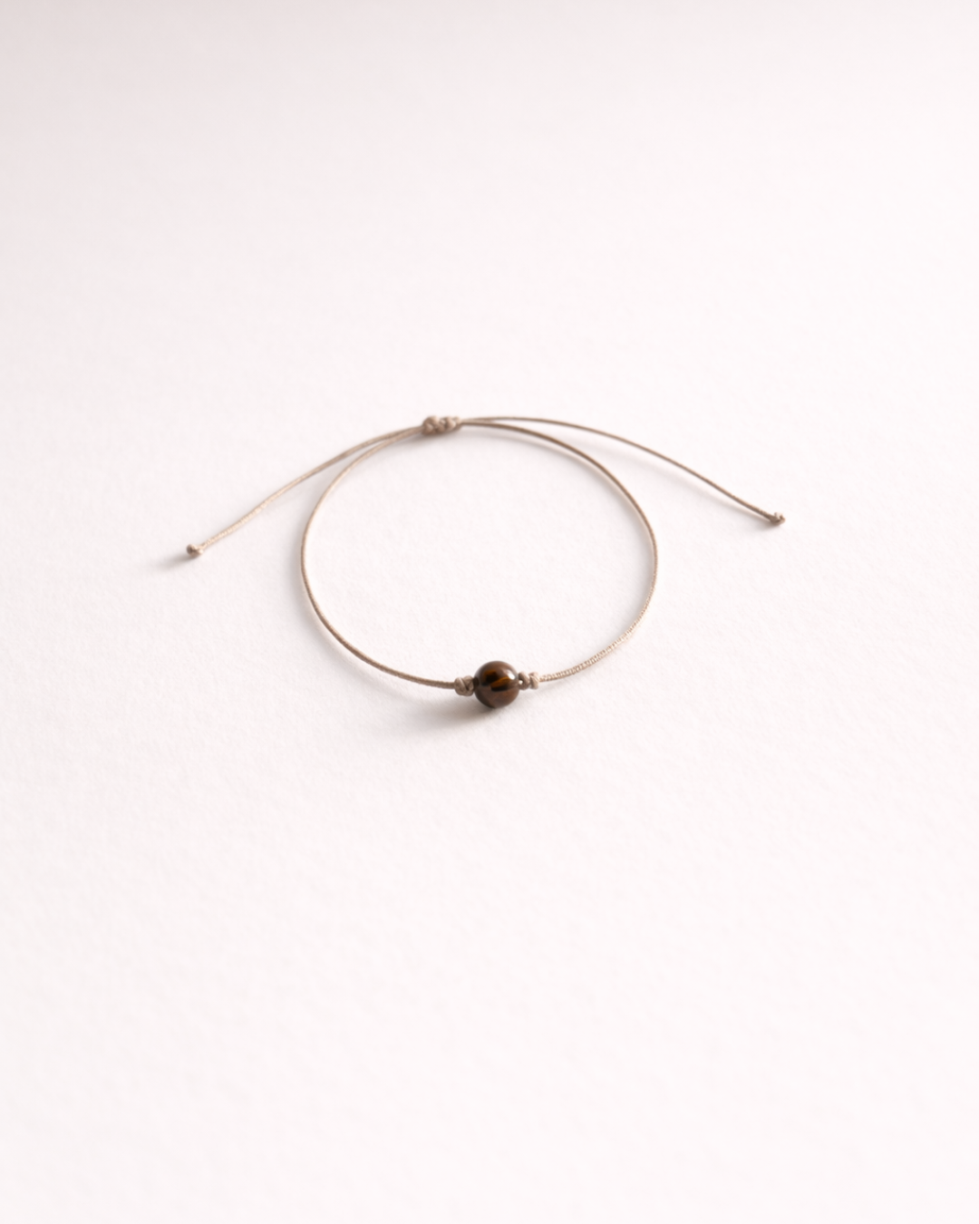 Pulsera de ojo de tigre incluida con vela Poder