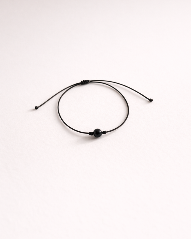 Pulsera de turmalina negra incluida con vela Protección